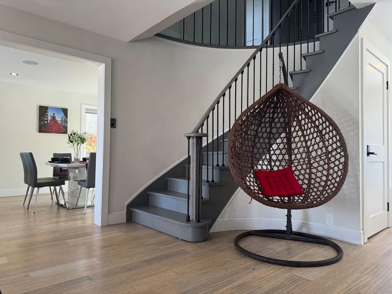 Hallway with a curved staircase.